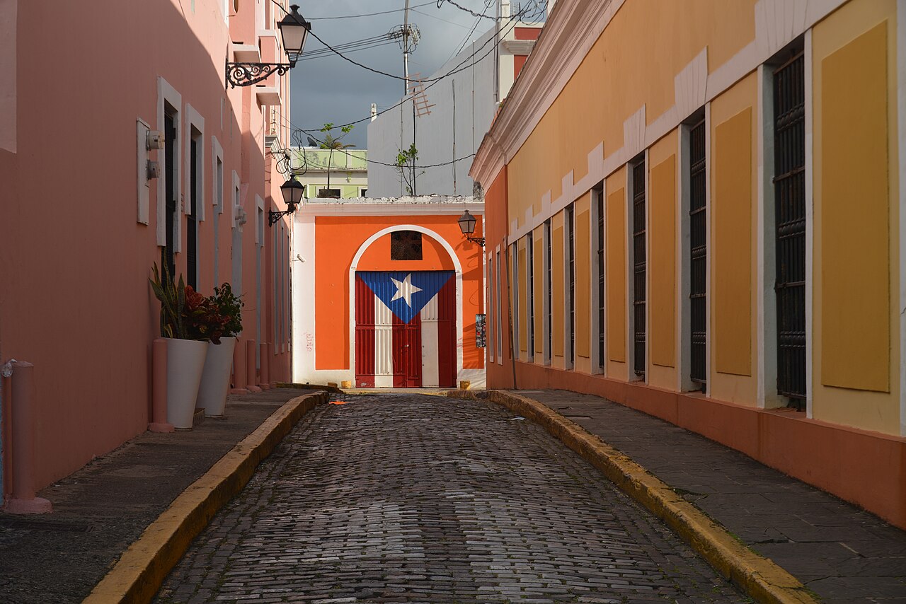Cobblestone street and a Puerto Rican flag-painted doorway in Old San Juan