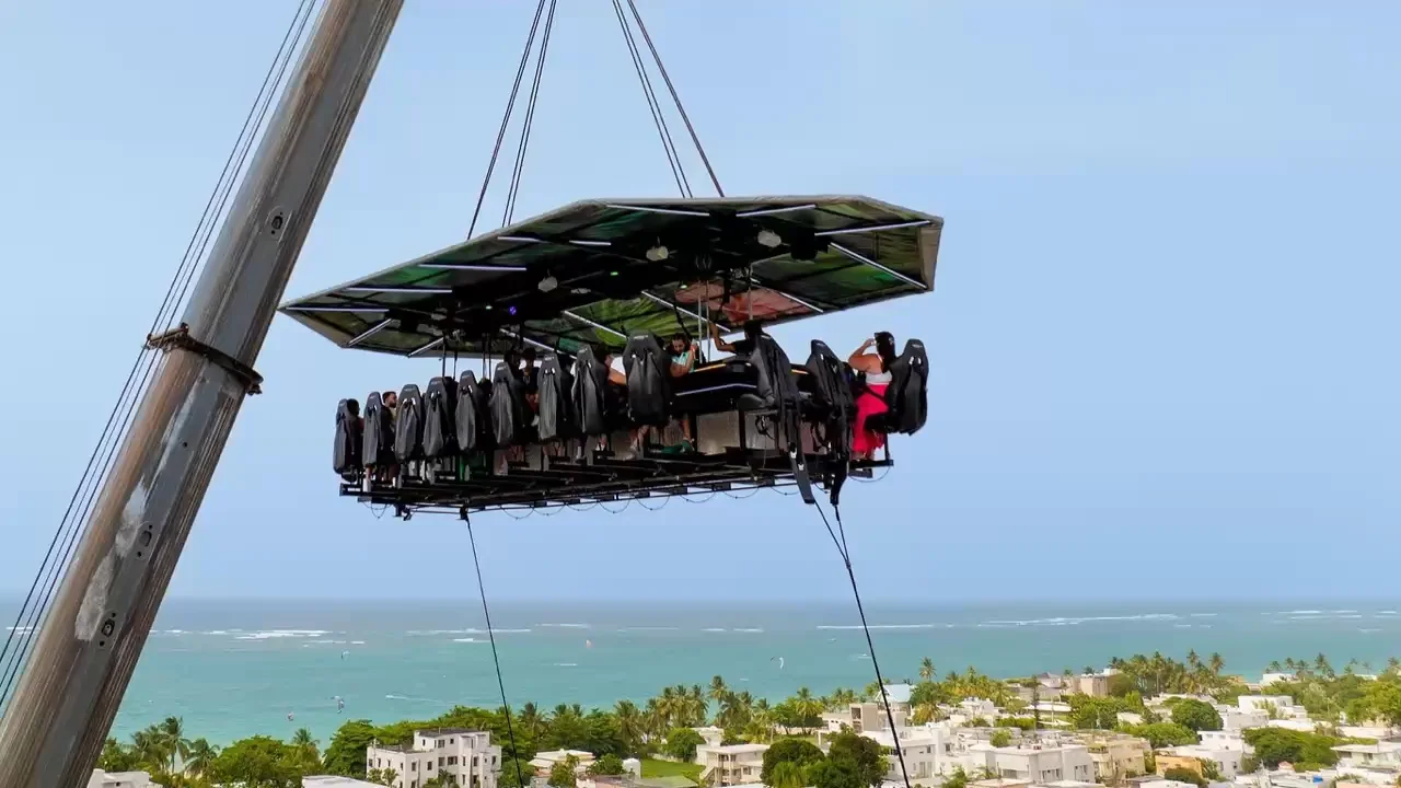 FlyDining guests suspended above the Old San Juan coast