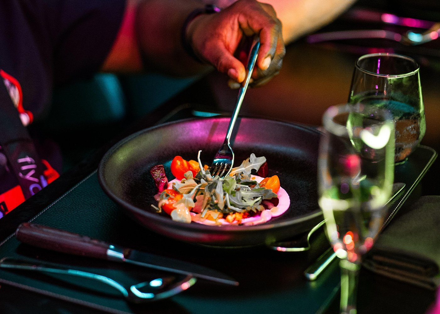 A FlyDining guest enjoying a plated dinner